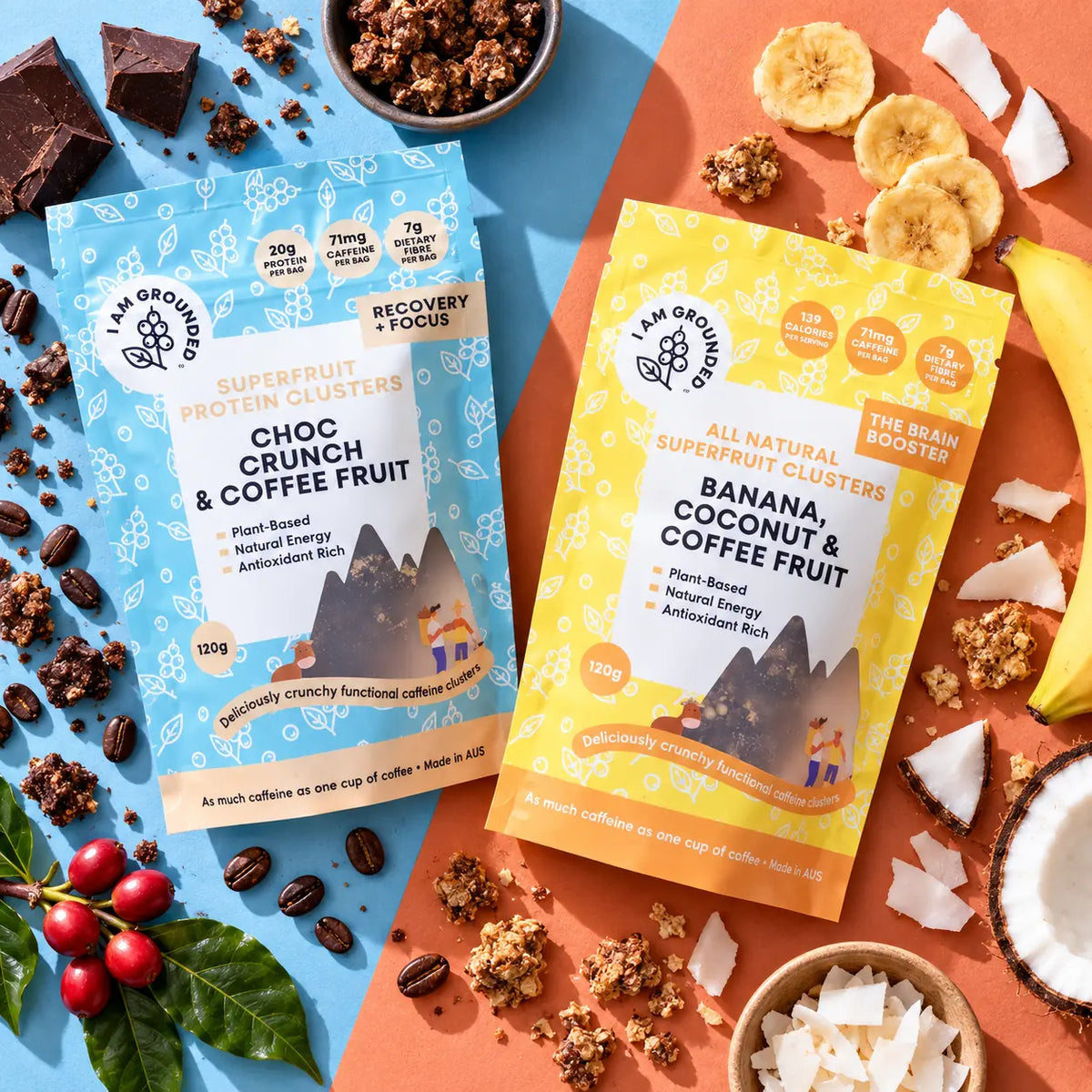 Two stand-up pouches of protein clusters are arranged on a split blue and peach background with fruit and granola props. The left pouch is light blue and labeled Choc Crunch & Coffee Fruit; the right pouch is yellow and labeled Banana, Coconut & Coffee Fruit.